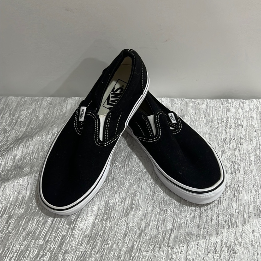 Vans Black and White Slip-On Sneakers